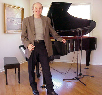 Gary in front of his prized Yamaha grand piano.